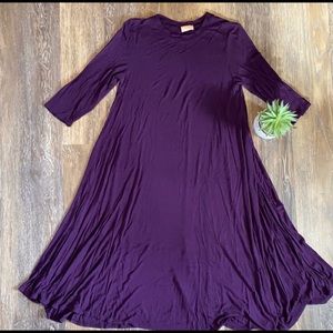 Purple midi swing dress.